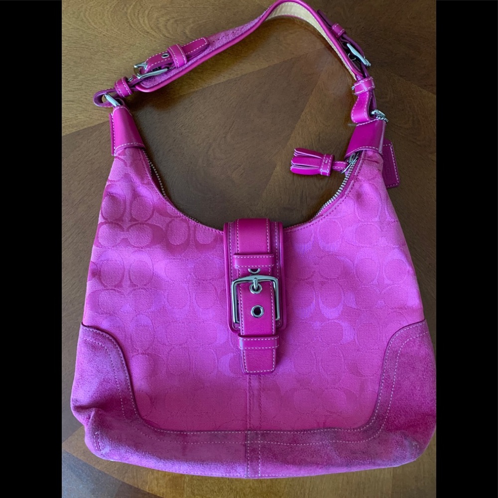 Coach purse in vibrant fuchsia color